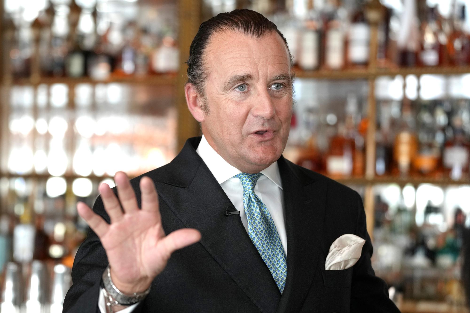 Luca Virgilio, General Manager of The Dorchester Hotel is interviewed in London, Thursday, April 20, 2023. The Dorchester Hotel, long a favorite with royals and celebrities, concocted a lavish, five-tier coronation cake and put up theater-style draping across its facade to re-create the decorations that it used to mark Queen Elizabeth II’s coronation in 1953 in preparation for King Charles III's coronation on May 6. (AP Photo/Kirsty Wigglesworth)