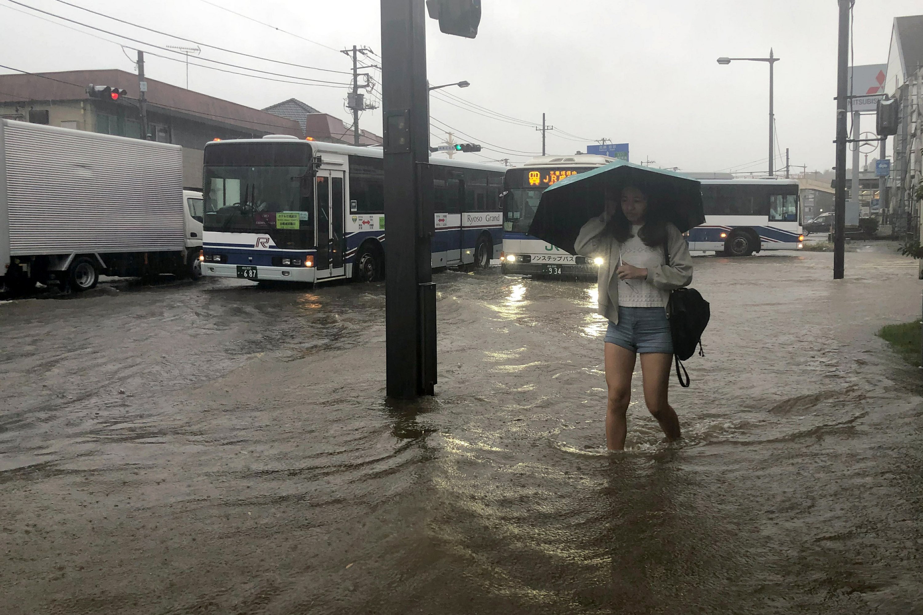 Heavy rains flood areas of Japan recovering from typhoons AP News