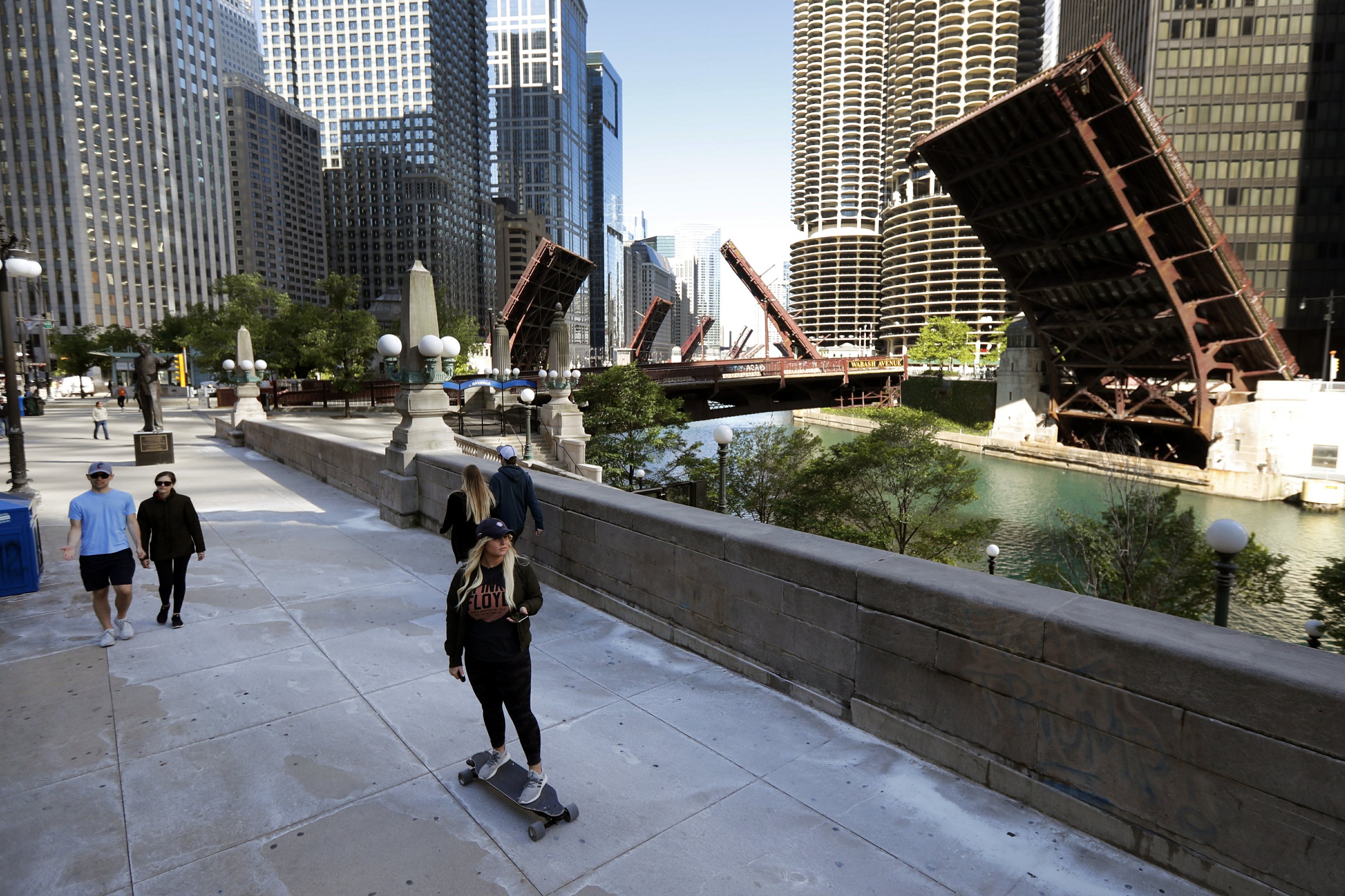 After downtown Chicago protests, unrest spreads to suburbs | AP News