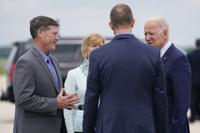 FILE - In this June. 29, 2021 file photo, President Joe Biden talks with Rep. Ron Kind, D-Wis., left, Sen. Tammy Baldwin, D-Wis., and La Crosse Mayor Mitch Reynolds as he arrives on Air Force One at La Crosse Regional Airport, in La Crosse, Wis. Kind, who served more than 24 years in a southwestern Wisconsin district that former President Donald Trump carried in 2020, announced Tuesday, Aug. 10, 2021, that he won't seek reelection in 2022. (AP Photo/Evan Vucci File)