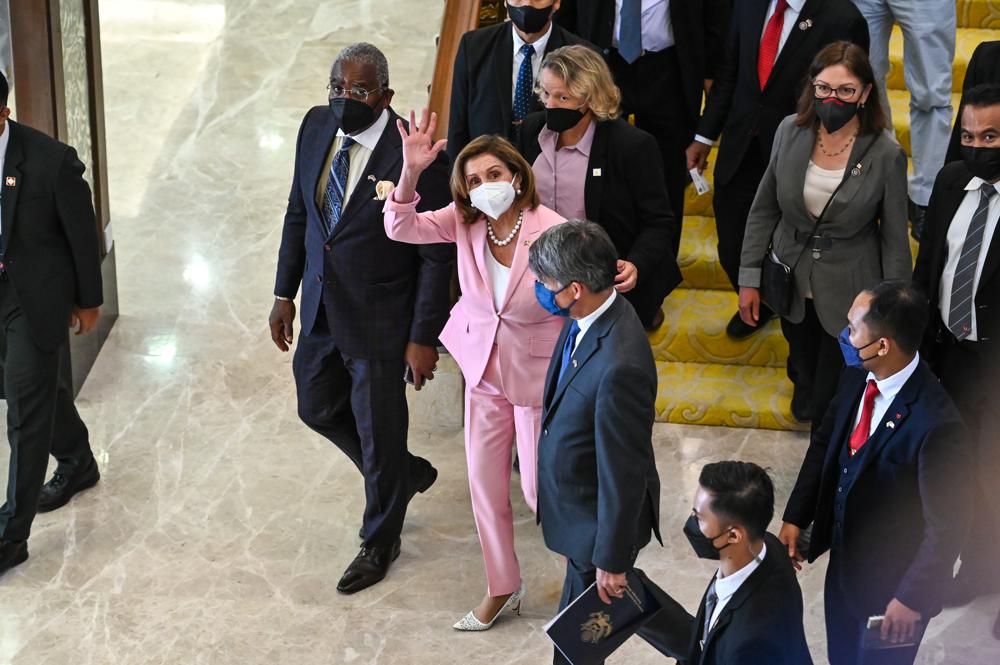 This handout photo taken and released by Malaysia’s Department of Information, U.S. House Speaker Nancy Pelosi, center, waves to media as she tours the parliament house in Kuala Lumpur, Tuesday, Aug. 2, 2022. AP/RSS Photo