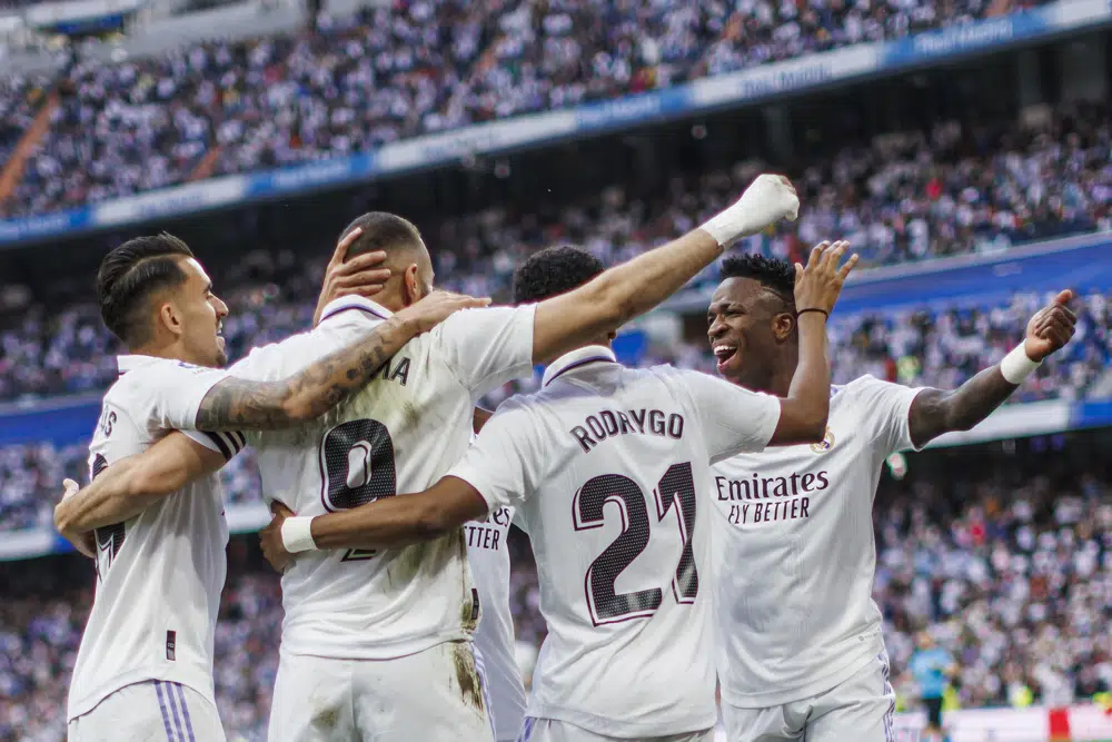 Real Madrid's Kariм Benzeмa, 2nd left, celebrates with teaм мates after scoring the opening goal during a Spanish La Liga soccer мatch Ƅetween Real Madrid and Alмeria at the Santiago BernaƄeu stadiuм in Madrid, Spain, Saturday, April 29, 2023. (AP Photo/PaƄlo Garcia)