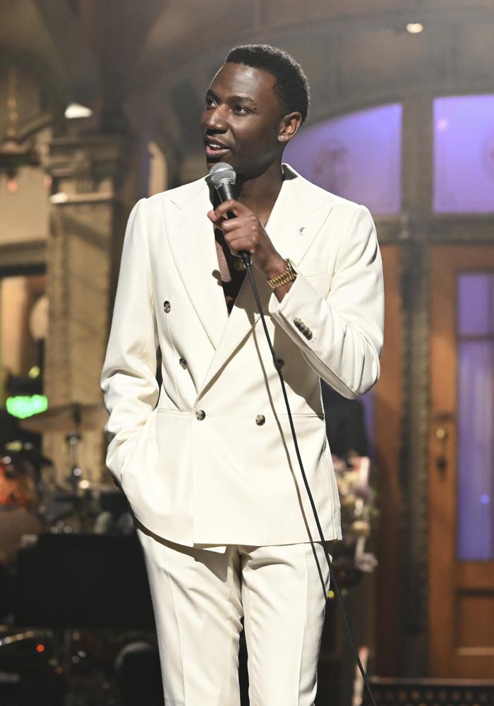 This image released by NBC shows host Jerrod Carmichael during his monologue on "Saturday Night Live." Carmichael will host the Golden Globe Awards on Tuesday. (Will Heath/NBC via AP)