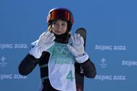 FILE - Eileen Gu, of China, waves after competing during the women's freestyle skiing big air finals of the 2022 Winter Olympics, Feb. 8, 2022, in Beijing. (AP Photo/Jae C. Hong, File)