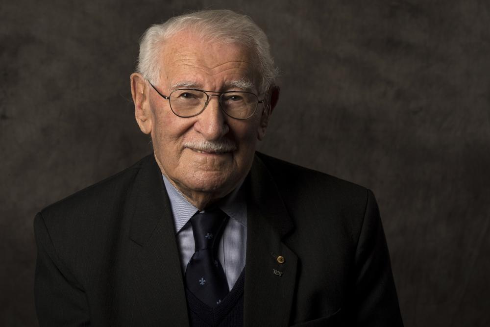 In this undated photo provided by the Sydney Jewish Museum, Holocaust survivor Eddie Jaku poses for a photograph in Sydney, Australia. Jaku, who last year published his best-selling memoir, “The Happiest Man on Earth,” has died in Sydney, a Jewish community leader said. He was 101. (Sydney Jewish Museum via AP)