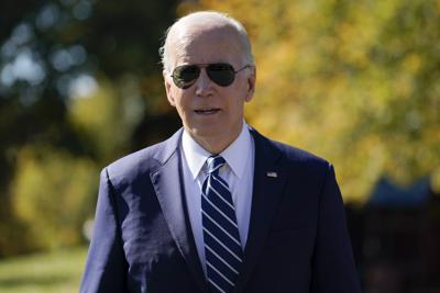 President Joe Biden talks to reporters before boarding Marine One on the South Lawn of the White House, Thursday, Oct. 27, 2022, in Washington. (AP Photo/Evan Vucci)