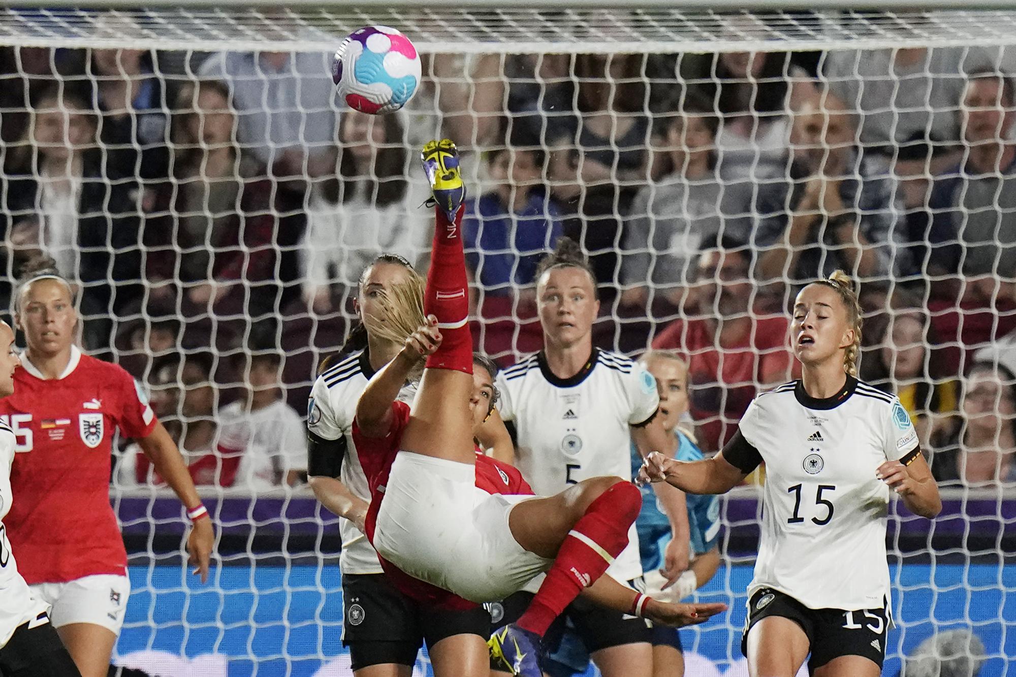 FILE - Austria's Marina Georgieva, center, tries to score with an overhead kick during the Women Euro 2022 quarter final soccer match between Germany and Austria at Brentford Community Stadium in London, Thursday, July 21, 2022. (AP Photo/Alessandra Tarantino, File)