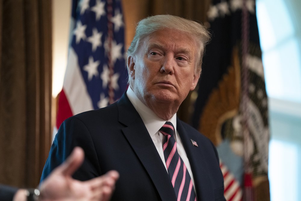 President Donald Trump listens during a demonstration of ways NASA is helping to combat the coronavirus, in the Cabinet Room of the White House, Friday, April 24, 2020, in Washington. (AP Photo/Evan Vucci)