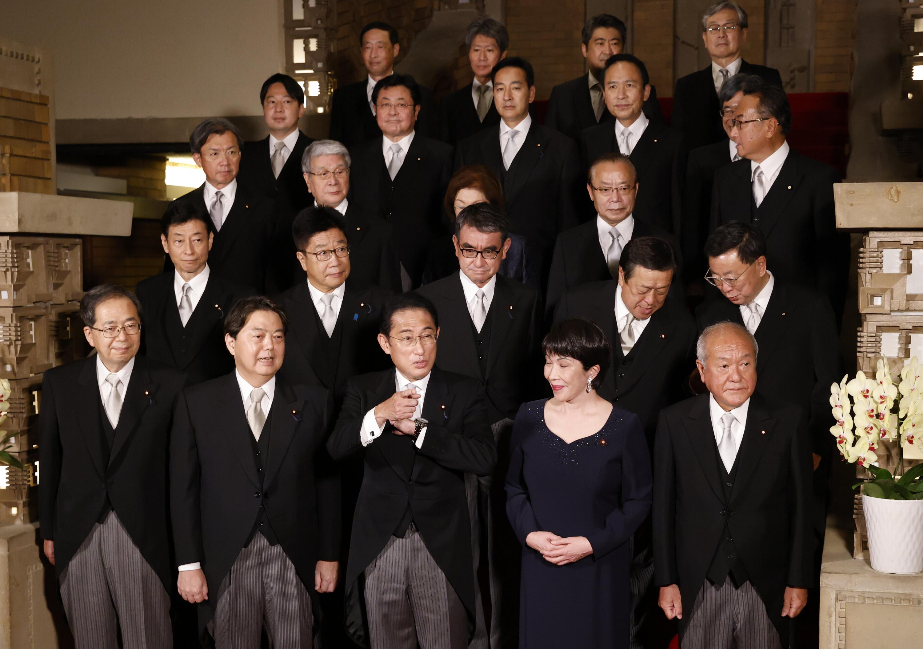 Japan PM purges Cabinet after support falls over church ties