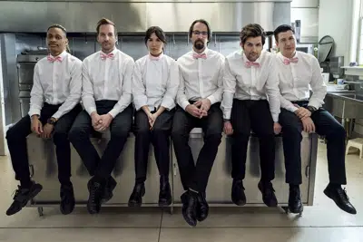 This image released by Starz shows Tyrel Jackson Williams, from left, Ryan Hansen, Zoe Chao, Martin Starr, Adam Scott and Ken Marino in a scene from the third season of "Party Down." (Colleen Hayes/Starz via AP)