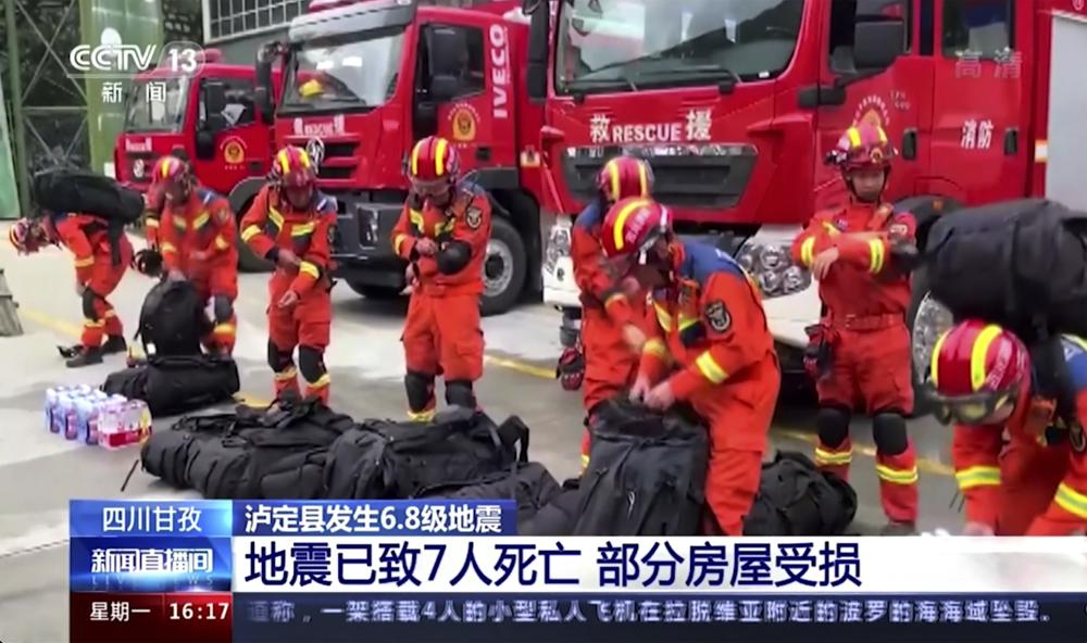 In this image taken from video footage run by China's CCTV, rescuers prepare their duty following an earthquake in Luding County of southwest China's Sichuan Province Monday, Sept. 5, 2022. A strong earthquake killed multiple people, triggered landslides and shook residents in a major city under lockdown in southwestern China on Monday, state media reported. (CCTV via AP)