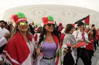 FILE - Female Morocco fans arrive at the stadium before the World Cup quarterfinal soccer match between Morocco and Portugal, at Al Thumama Stadium in Doha, Qatar, Saturday, Dec. 10, 2022. (AP Photo/Ebrahim Noroozi, File)