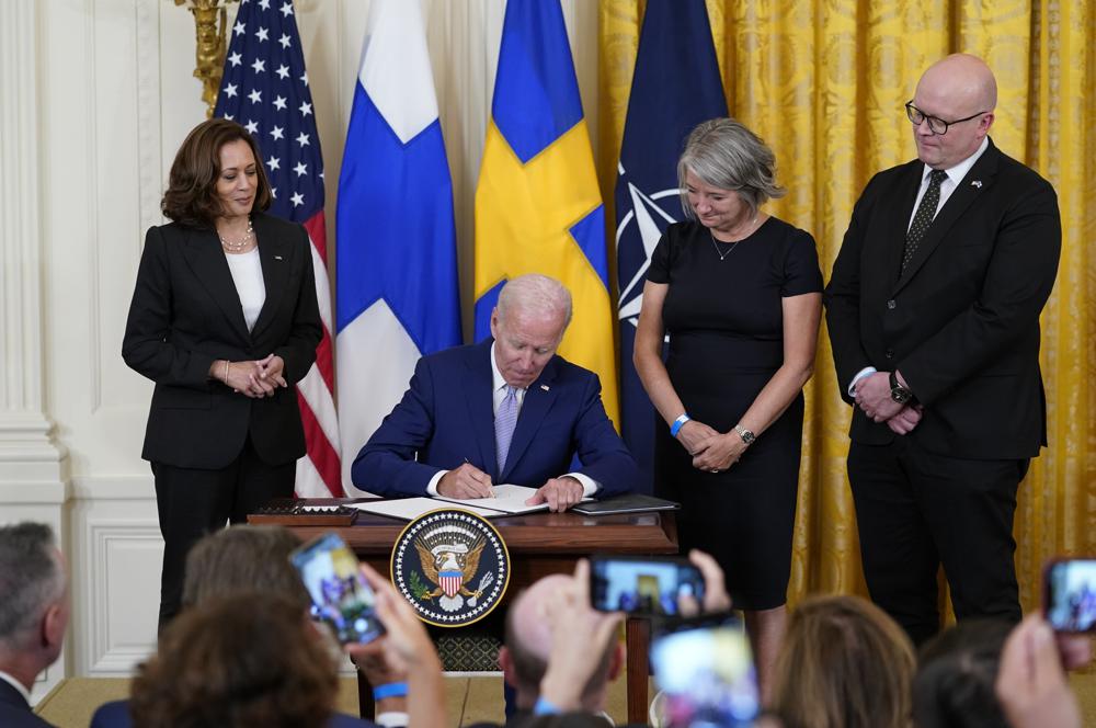 President Joe Biden signs the Instruments of Ratification for the Accession Protocols to the North Atlantic Treaty for the Kingdom of Sweden in the East Room of the White House in Washington, Tuesday, Aug. 9, 2022. From left, Vice President Kamala Harris, Biden, Karin Olofsdotter, Sweden's ambassador to the U.S., and Mikko Hautala, Finland's ambassador to the U.S. (AP Photo/Susan Walsh)