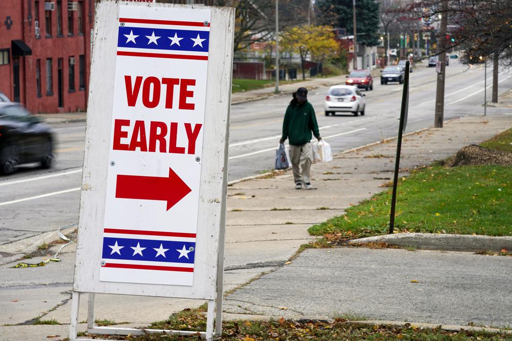 A sign is seen outside a polling station Tuesday, Oct. 25, 2022, in Milwaukee. Tuesday is the first day to vote early in Wisconsin. (AP Photo/Morry Gash)