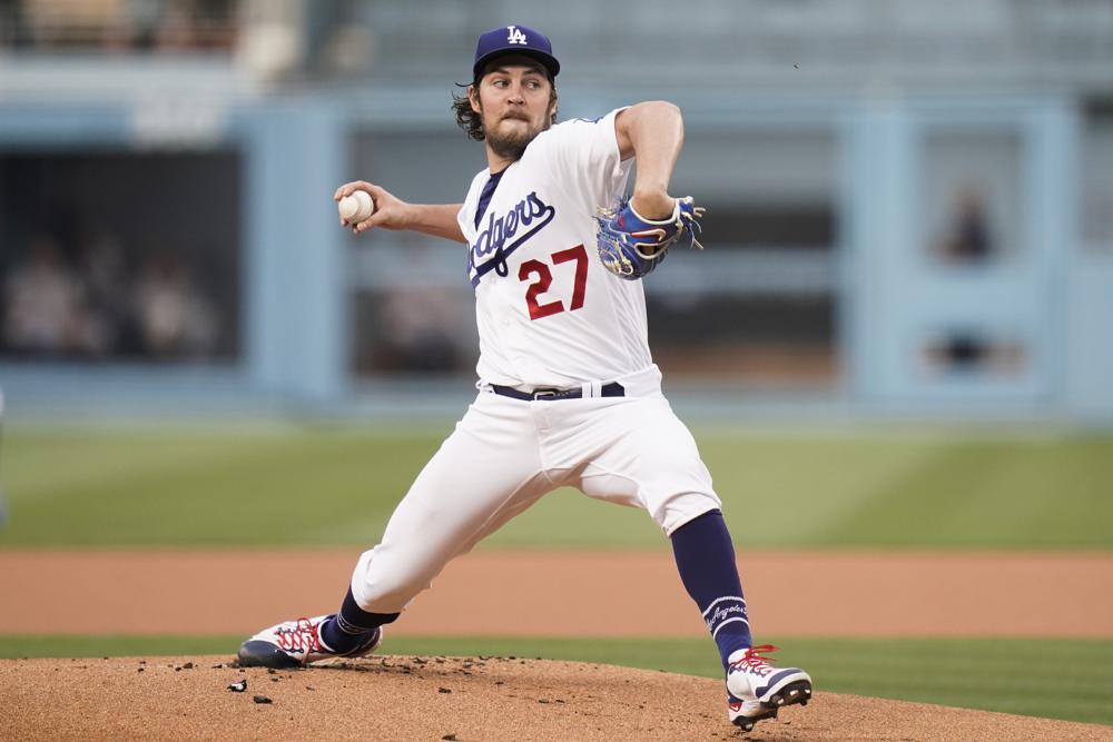 FILE - In this June 28, 2021, file photo, Los Angeles Dodgers starting pitcher Trevor Bauer throws against the San Francisco Giants during the first inning of a baseball game, in Los Angeles. A Los Angeles judge sided with Bauer on Thursday, Aug. 19, 2021, and denied a restraining order to a woman who said he choked her into unconsciousness and punched her repeatedly during two sexual encounters. (AP Photo/Jae C. Hong, File)