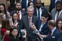 Reporters encircle Speaker of the House Kevin McCarthy, R-Calif., as debt limit negotiations continue, at the Capitol in Washington, Thursday, May 25, 2023. McCarthy adjourned the House for the Memorial Day weekend. (AP Photo/J. Scott Applewhite)