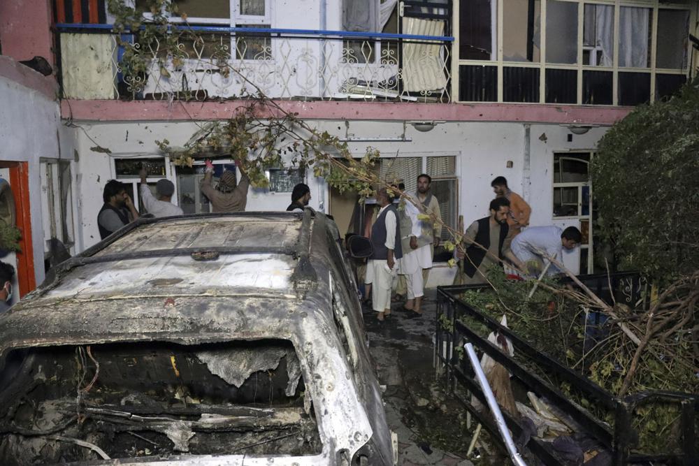 Afghans inspect damage of Ahmadi family house after U.S. drone strike on Aug. 29, 2021, in Kabul, Afghanistan. An independent Pentagon review has concluded that the U.S. drone strike that killed innocent Kabul civilians and children in the final days of the Afghanistan war was not caused by misconduct or negligence, and it doesn't recommend any disciplinary action, The Associated Press has learned. (AP Photo/Khwaja Tawfiq Sediqi, File)