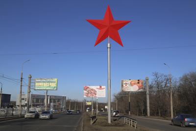 A huge red star rises over a street in Donetsk, the territory controlled by pro-Russian militants, eastern Ukraine, Monday, Feb. 14, 2022. Amid fears of a Russian invasion of Ukraine, tensions have also soared in the country’s east, where Ukrainian forces are locked in a nearly eight-year conflict with Russia-backed separatists. A sharp increase in skirmishes on Thursday raised fears that Moscow could use the situation as a pretext for an incursion. (AP Photo/Alexei Alexandrov)