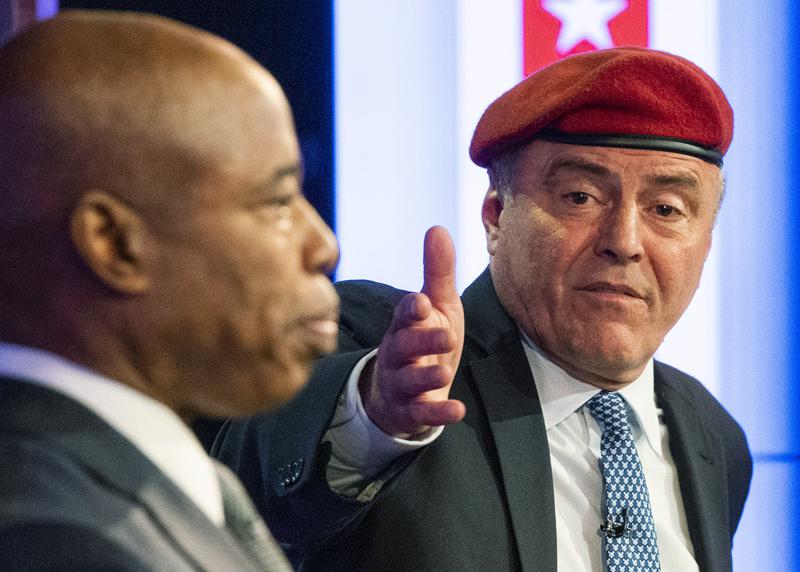 File - Republican candidate for New York City mayor, Curtis Sliwa, right, speaks during a debate with Democratic mayoral candidate Eric Adams in New York, Tuesday, Oct. 26, 2021. Campaign staffers for Sliwa say he has been hit by a yellow cab and taken to a hospital as a precaution. (Eduardo Munoz/Pool Photo via AP, File)