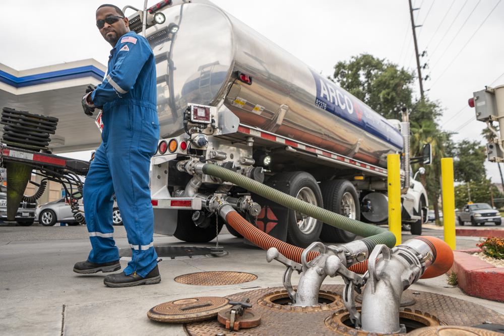 A driver delivers gasoline to a gas station in California