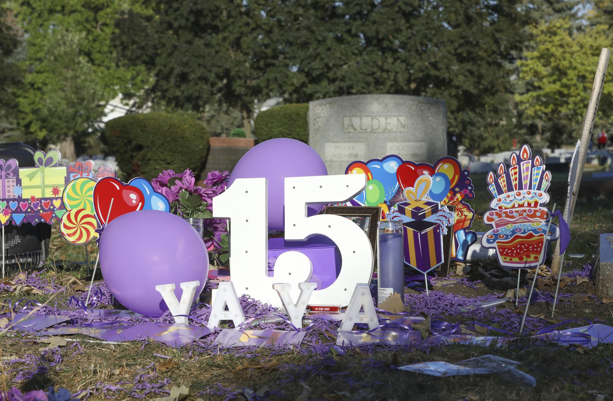 Amaria Jones's grave in Hillside, Ill,, is decorated for what would have been her 15th birthday on Saturday, Sept. 18, 2021. Gun violence is killing an increasing number of American children, many of them caught in crossfire. When a stray bullet pierced the window of a Chicago home in 2020, it hit and killed 13-year-old Amaria as she danced for her mother. (AP Photo/Teresa Crawford)