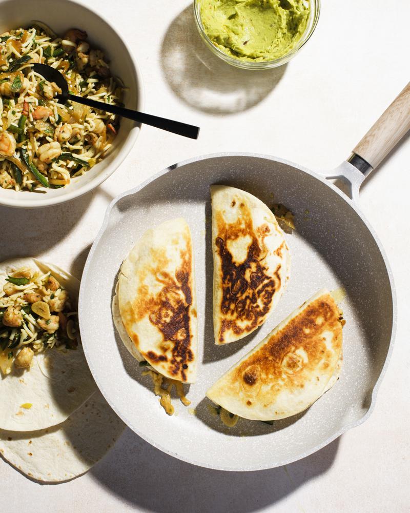 This image released by Milk Street shows a recipe for shrimp and cheese tacos. (Milk Street via AP)