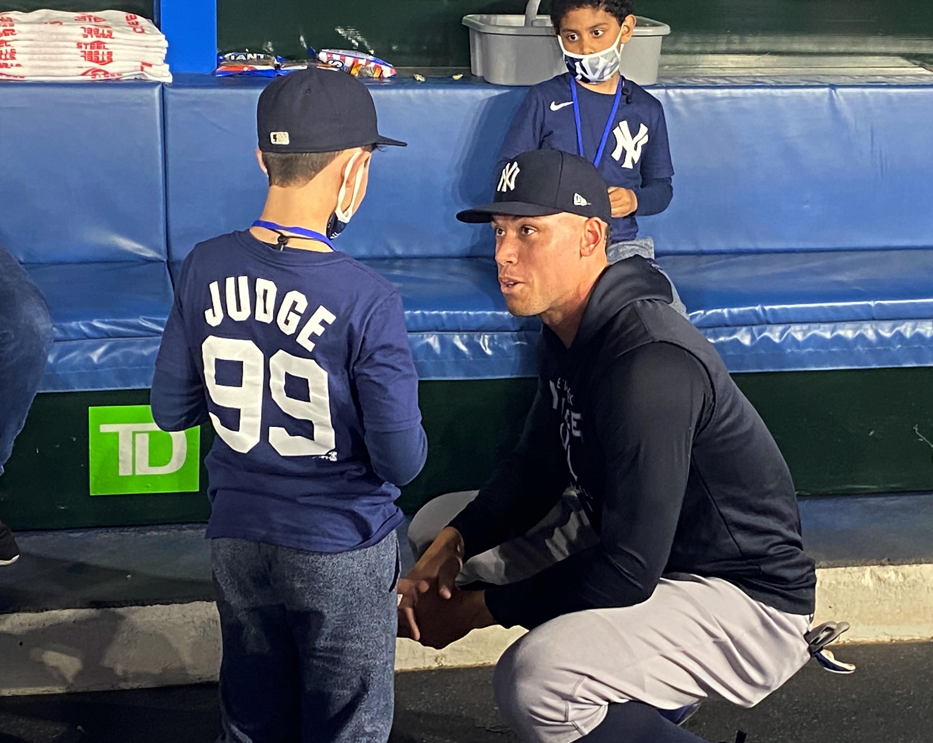 Young Yankees fan given Judge HR ball meets his hero | AP News