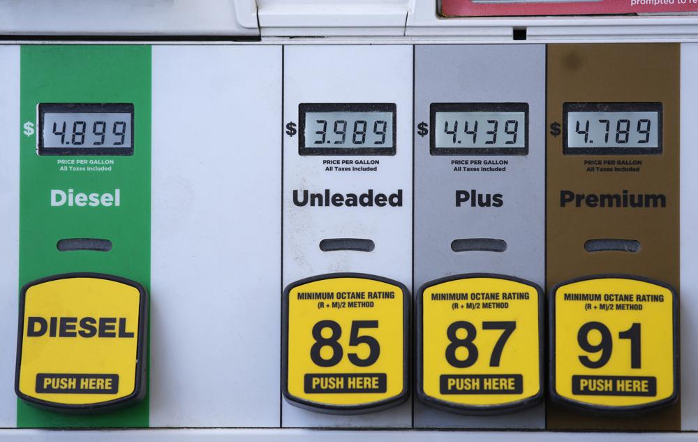 Digital displays are illuminated to mark the prices for the various grades of gasoline available from a pump at a Circle K station Friday, April 22, 2022, in south Denver. (AP Photo/David Zalubowski)