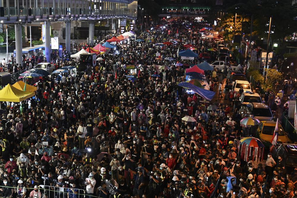 Anti-government protesters participate in a rally in Bangkok, Thailand, Sunday, Oct. 31, 2021. Protesters who have been seeking political reforms since late 2019 said at their rally that they would seek to get 1 million signatures to submit to Parliament calling for abolition of a lese majeste law that is used to punish critics of the country's monarchy. (AP Photo/Surat Suppakun)