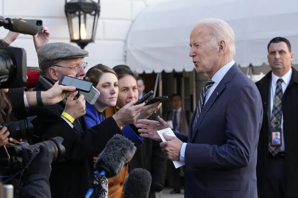 President Joe Biden talks with reporters before he and first lady Jill Biden board Marine One on the South Lawn of the White House in Washington, Wednesday, Jan. 11, 2023. Jill Biden is having surgery to remove a small lesion found above her right eye during a routine skin cancer screening (AP Photo/Susan Walsh)