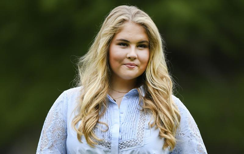 FILE - In this Friday, July 17, 2020 file photo, Netherlands' Princess Amalia poses in the garden of royal palace Huis ten Bosch in The Hague, Netherlands. The heir to the Dutch throne, Princess Amalia, has decided not to accept the allowance -- worth some 1.6 million euros ($1.9 million) per year -- that she is due to receive annually once she turns 18 in December. The princess sent a hand-written letter to Dutch Prime Minister Mark Rutte informing him of her decision on Friday, June 11, 2021. (Piroschka van de Wouw, Pool via AP, File)