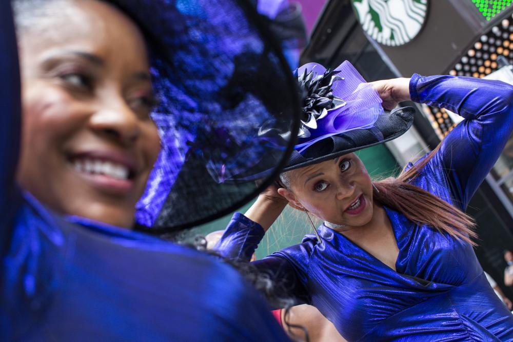 Women wait to perform during a free outdoor event organized by The Broadway League during Juneteenth celebrations at Times Square on Saturday, June 19, 2021, in New York. Parades, picnics and lessons in history marked Juneteenth celebrations in the U.S., a day that marks the arrival of news to enslaved Black people in a Texas town that the Confederacy had surrendered in 1865 and they were free. (AP Photo/Eduardo Munoz Alvarez)