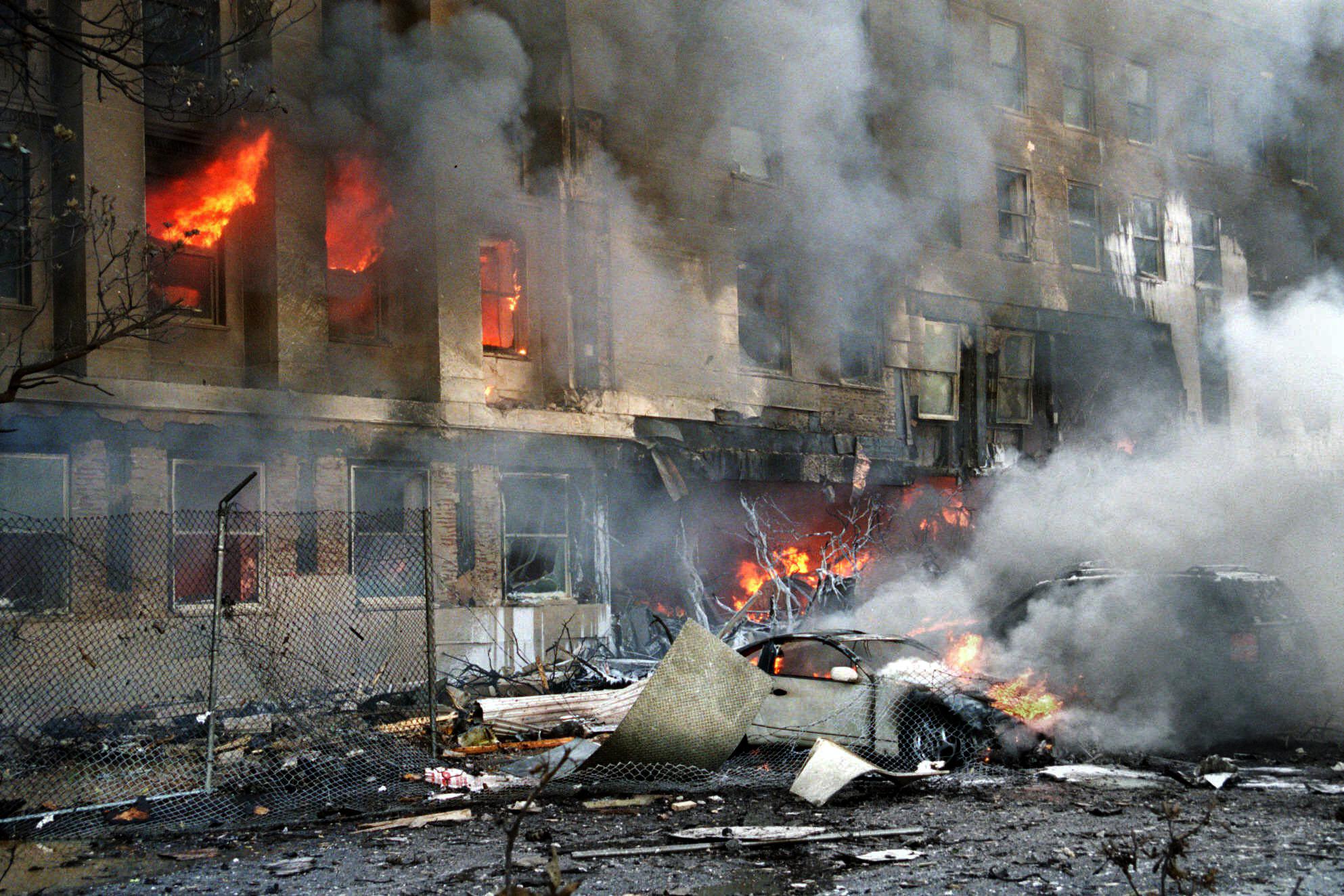 Flames and smoke pour from a building at the Pentagon in Washington on Tuesday, Sept. 11, 2001. (AP Photo/Will Morris)