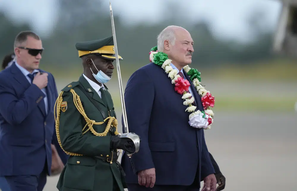 Belarus President Alexander Lukashenko, right, arrives at Robert Mugabe International airport in Harare, Monday, Jan, 30, 2023. (AP Photo/Tsvangirayi Mukwazhi)