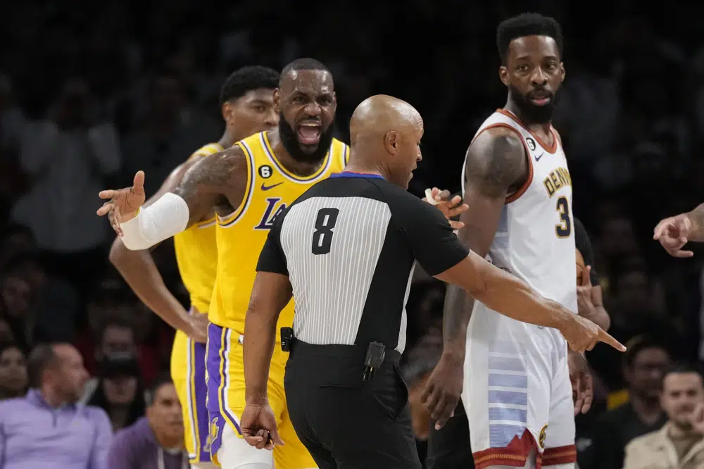 Los Angeles Lakers forward LeBron James, left, argues a call next to Denver Nuggets forward Jeff Green, right, in the first half of Game 4 of the NBA basketball Western Conference Final series Monday, May 22, 2023, in Los Angeles. (AP Photo/Ashley Landis)