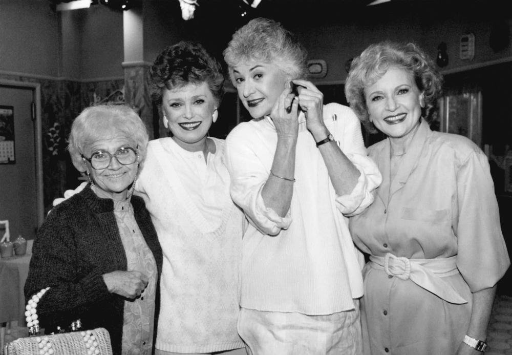 FILE - Actors from the television series "The " Golden Girls" stand together during a break in taping Dec. 25, 1985 in Hollywood. From left are, Estelle Getty, Rue McClanahan, Bea Arthur and Betty White.  Betty White, whose saucy, up-for-anything charm made her a television mainstay for more than 60 years, has died. She was 99.  (AP Photo/Nick Ut, File)