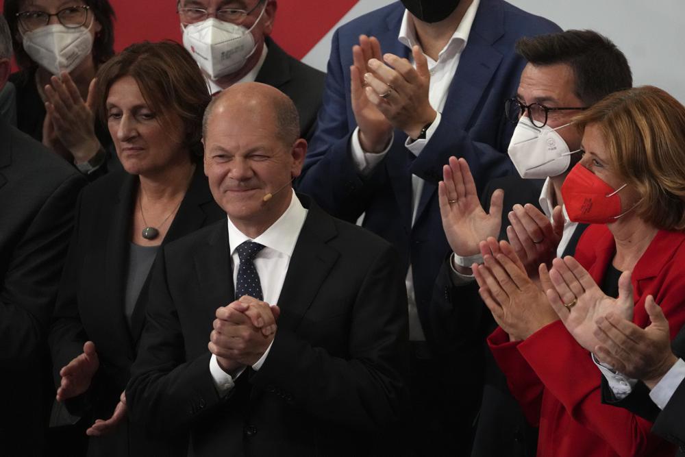 Olaf Scholz, Finance Minister and SPD candidate for Chancellor after addressing his supporters after German parliament election at the Social Democratic Party, SPD, headquarters in Berlin, Sunday, Sept. 26, 2021. (AP Photo/Michael Sohn)