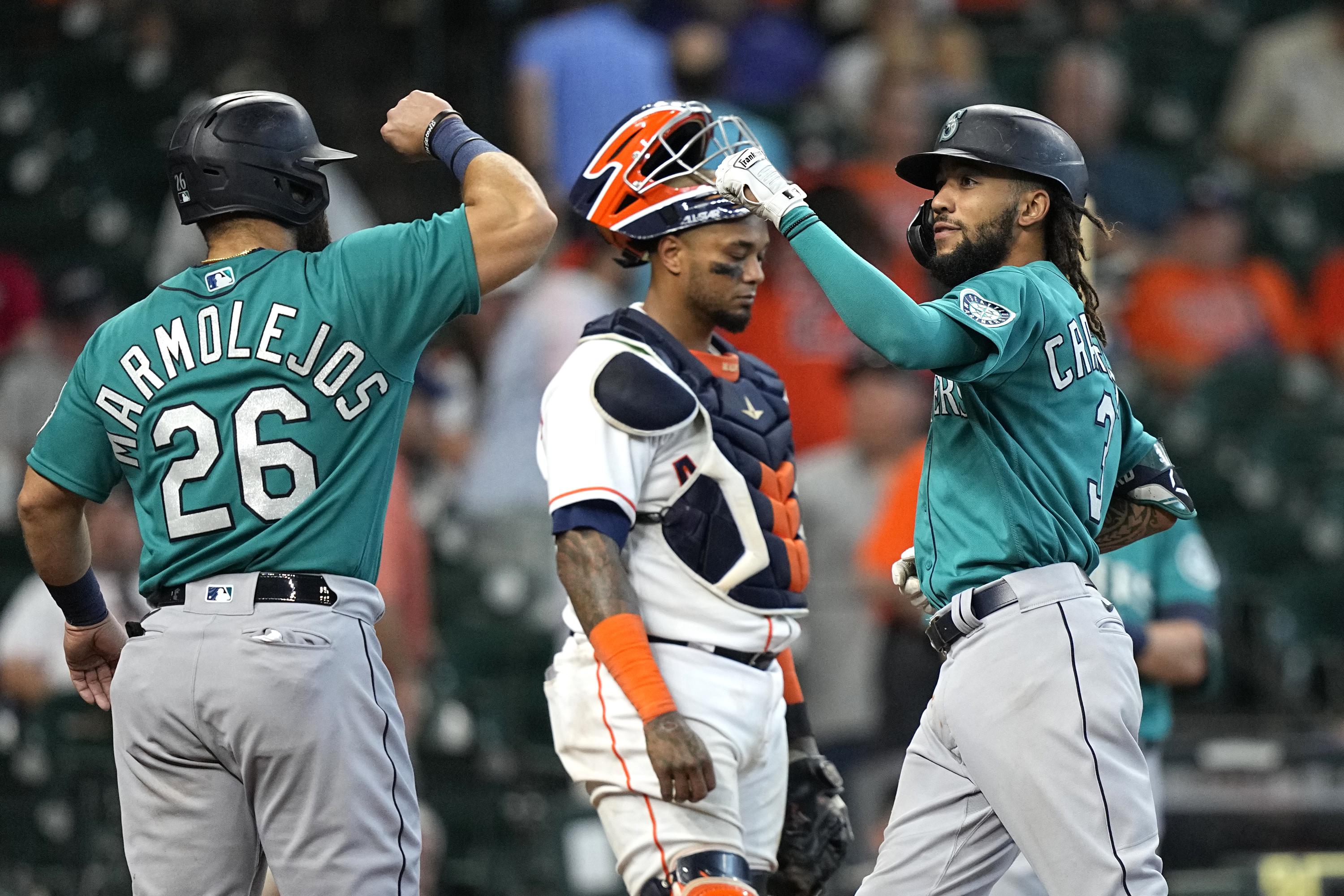 Marmolejos, Mariners score 4 in 9th, avoid sweep by Astros AP News