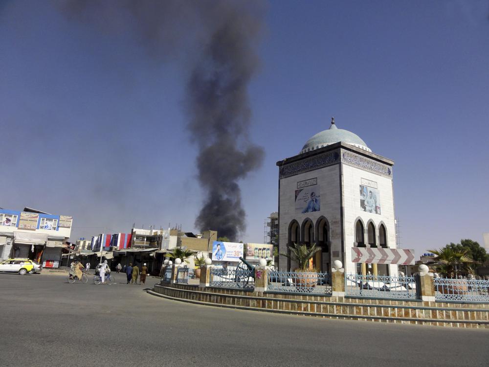 Smoke rises after fighting between the Taliban and Afghan security personnel, in Kandahar, southwest of Kabul, Afghanistan, Thursday, Aug. 12, 2021. (AP Photo/Sidiqullah Khan)