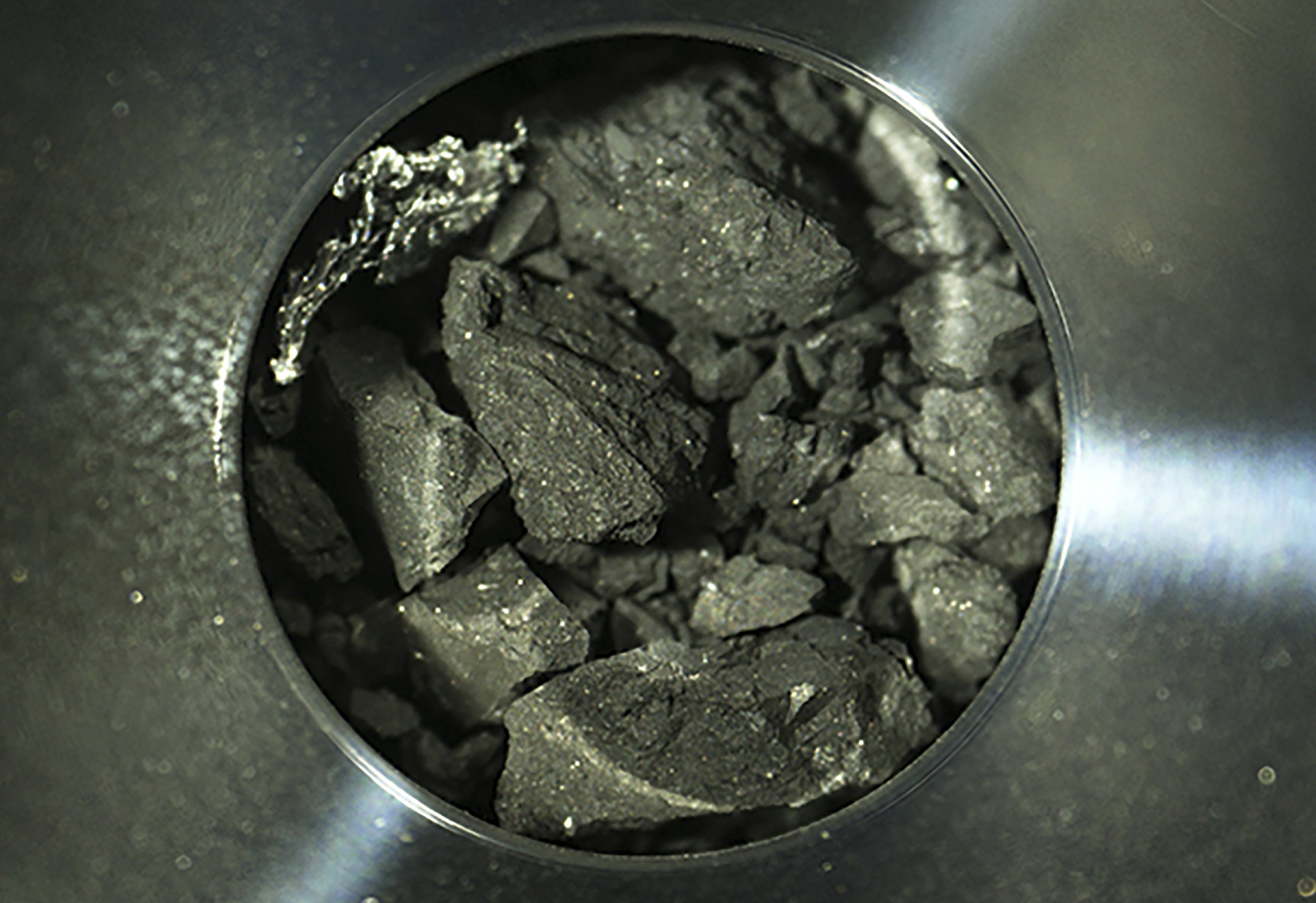 Gifts of the Japanese spaceship: asteroid chips like coal