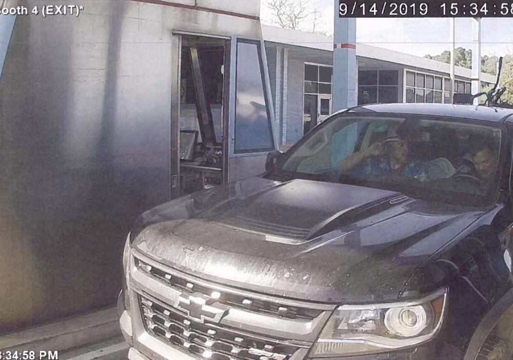 FILE - This image taken from a Sept. 14, 2019, video and released in a U.S. Attorney detention memorandum, shows Brian Mark Lemley Jr, driving, and Patrik Mathews, passenger seat, passing through a toll booth near Norfolk, Va., en route to Georgia. On Monday, Oct. 25, 2021, a federal judge agreed to sentence Lemley and Mathews, two neo-Nazi group members, under a terrorism law, a key ruling that favors prosecutors’ recommendation for both men to get 25-year prison sentences. (U.S. Attorney via AP, File)