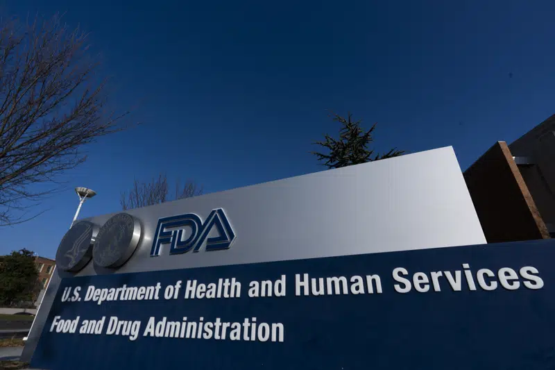 FILE - A sign in front of the Food and Drug Administration building is seen on Dec. 10, 2020, in Silver Spring, Md. Expedited drug approvals slowed in 2022, as the FDA's controversial accelerated pathway came under new scrutiny from Congress, government watchdogs and some of the agency’s own leaders. With less than a month remaining in the year, the agency’s drug center has granted 10 accelerated approvals — fewer than the tally in each of the last five years, when use of the program reached all-time highs. (AP Photo/Manuel Balce Ceneta, File)