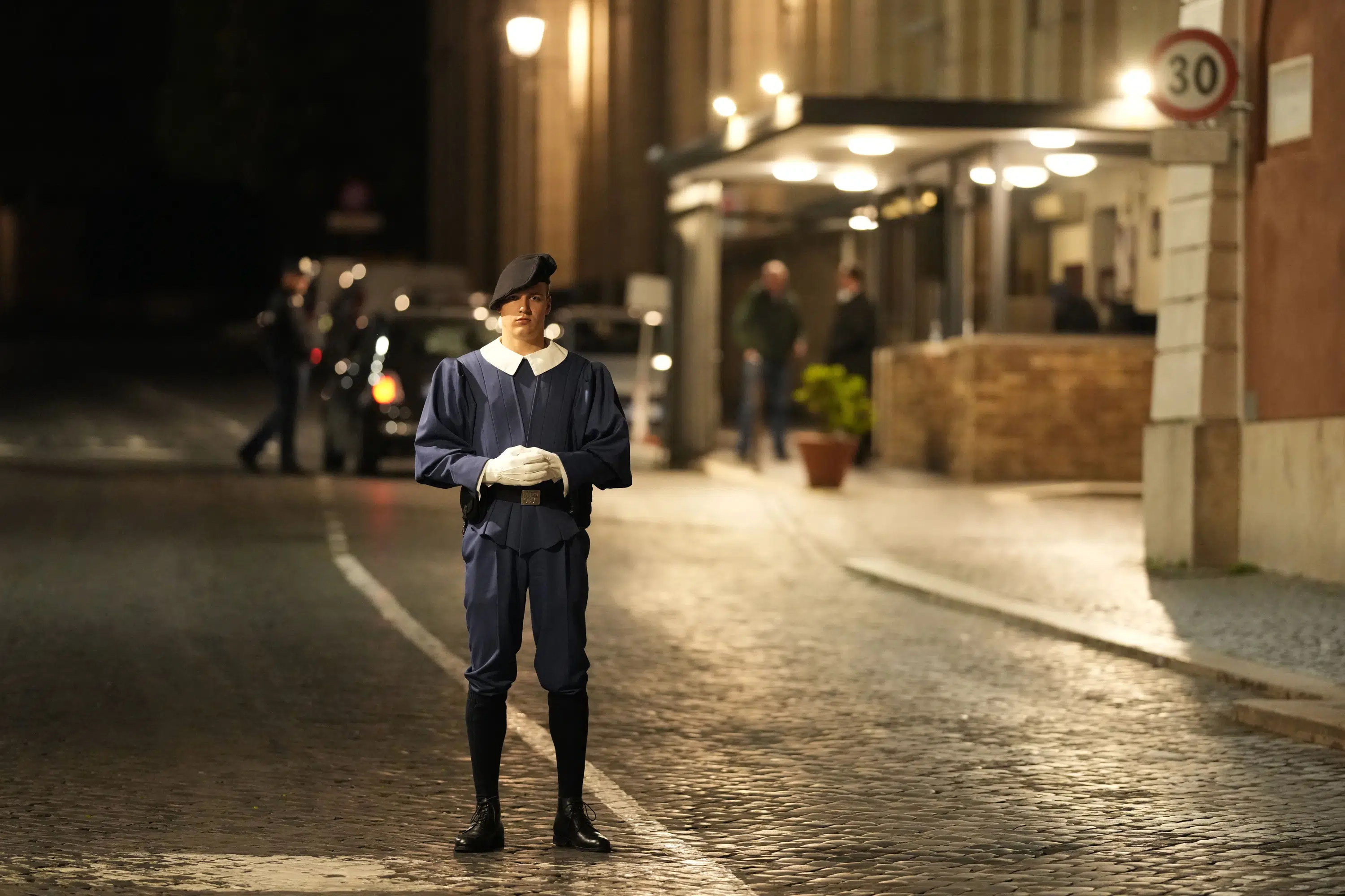 A car drives out of the Vatican gate, and is shot at by gendarmes;  The arrest of the driver after he reached the yard