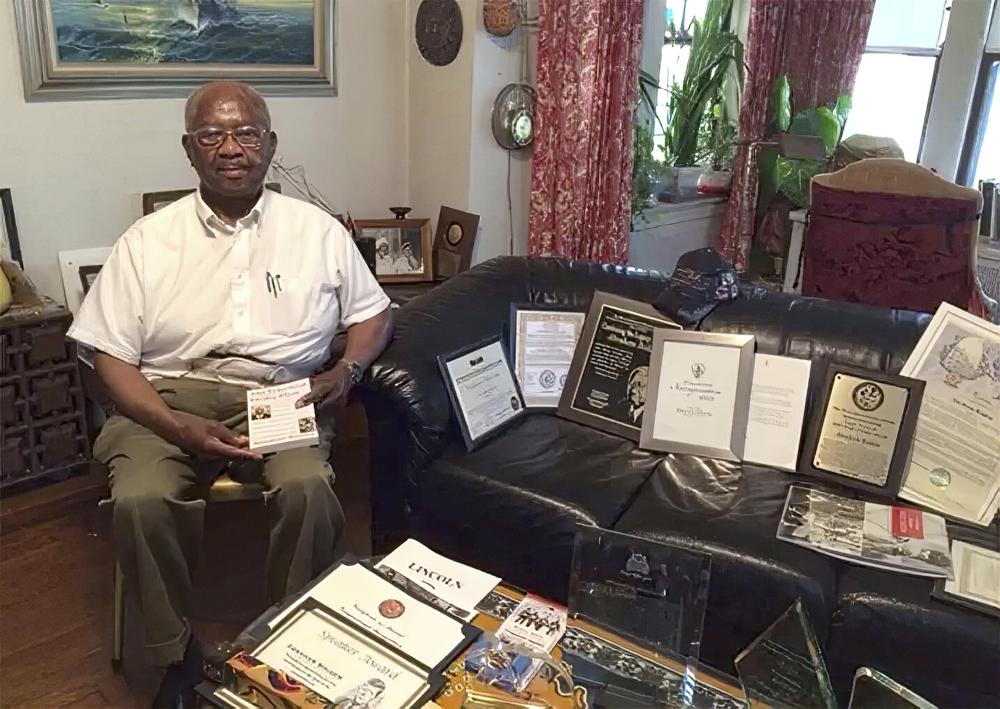 FILE - This 2016 photo shows Abraham Bolden at his South Side home in Chicago. Bolden, who served on President John F. Kennedy's detail, faced federal bribery charges that he attempted to sell a copy of a Secret Service file. His first trial ended in a hung jury. Following his conviction in a second trial, key witnesses admitted lying at the prosecutor's request. (Mary Mitchell/Chicago Sun-Times via AP)