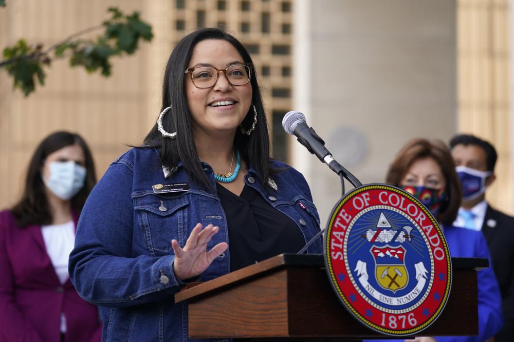 FILE - Colorado State Sen. Julie Gonzales speaks during a news conference on Oct. 15, 2020, in Denver. According to an analysis by The Associated Press, at least 18 states refer to immigrants as "alien" or "illegal" in state laws. In a March 2021 legislative committee hearing in Colorado, Gonzales, who co-sponsored a bill that has since become law, said terms like "illegal" were "dehumanizing and derogatory." (AP Photo/David Zalubowski, File)