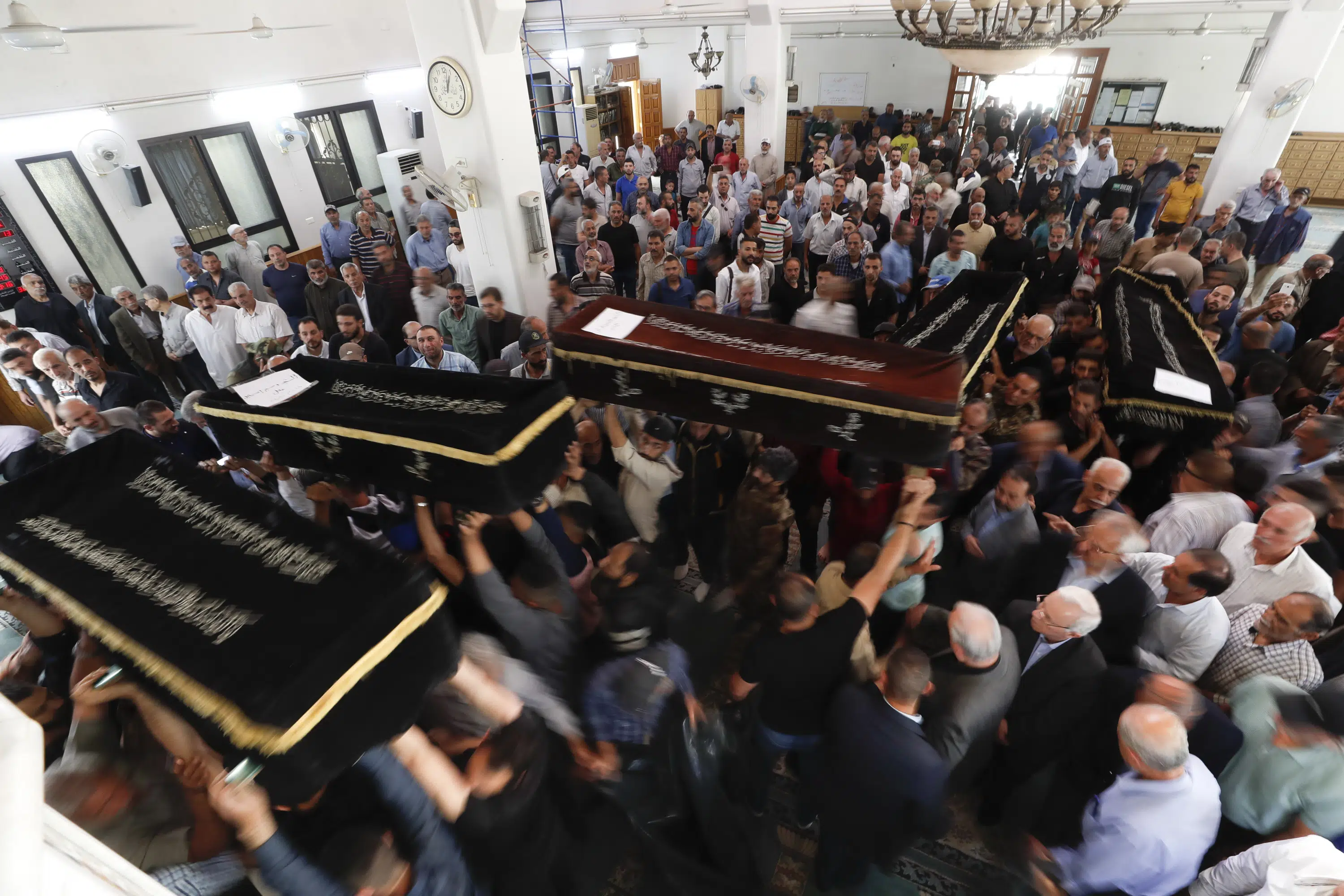 Palestinian militant group in Syria holds funeral for 5 killed in mysterious blast