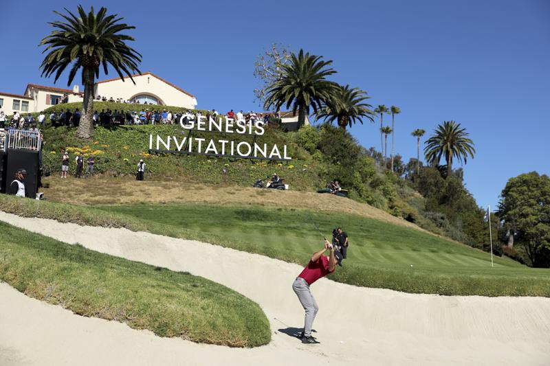 Joaquin Niemann, of Chile, hits out of the greenside bunker on the second hole during the third round of the Genesis Invitational golf tournament at Riviera Country Club, Saturday, Feb. 19, 2022, in the Pacific Palisades area of Los Angeles. (AP Photo/Ryan Kang)