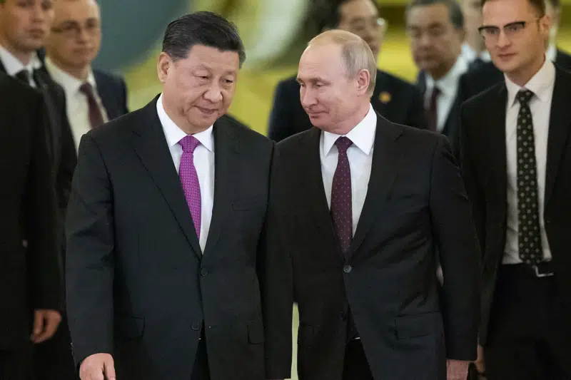 FILE - Chinese President Xi Jinping, left, and Russian President Vladimir Putin enter a hall for talks in the Kremlin in Moscow, Russia, June 5, 2019. The Chinese government said Xi would visit Moscow from March 20, to March 22, 2023, but gave no indication when he departed. The Russian government said Xi was due to arrive at midday and meet later with Putin.(AP Photo/Alexander Zemlianichenko, Pool, File)