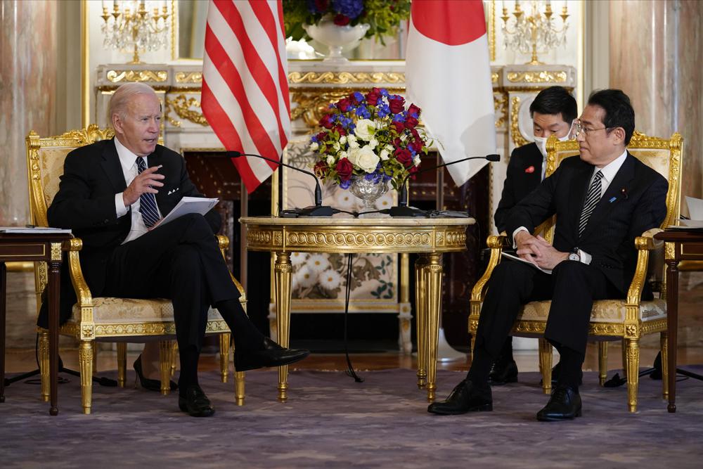 U.S. President Joe Biden, left, talks to Japanese Prime Minister Fumio Kishida during a bilateral meeting at Akasaka Palace, Monday, May 23, 2022, in Tokyo. (AP Photo/Evan Vucci)