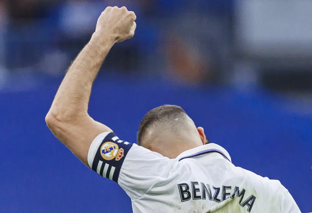 Real Madrid's Karim Benzema celebrates after scoring the opening goal during a Spanish La Liga soccer match between Real Madrid and Almeria at the Santiago Bernabeu stadium in Madrid, Spain, Saturday, April 29, 2023. (AP Photo/Pablo Garcia)